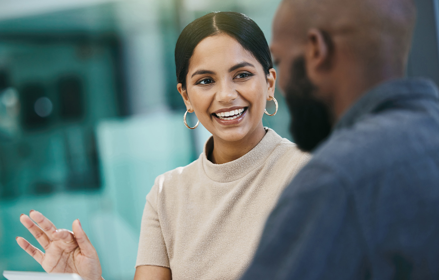 Two professionals engaged in conversation during a consultation, representing advisory and professional services in the theatre and entertainment industry.