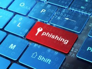 Privacy concept: Key and Phishing on computer keyboard