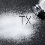Salt shaker with TX, representing the state of Texas.
