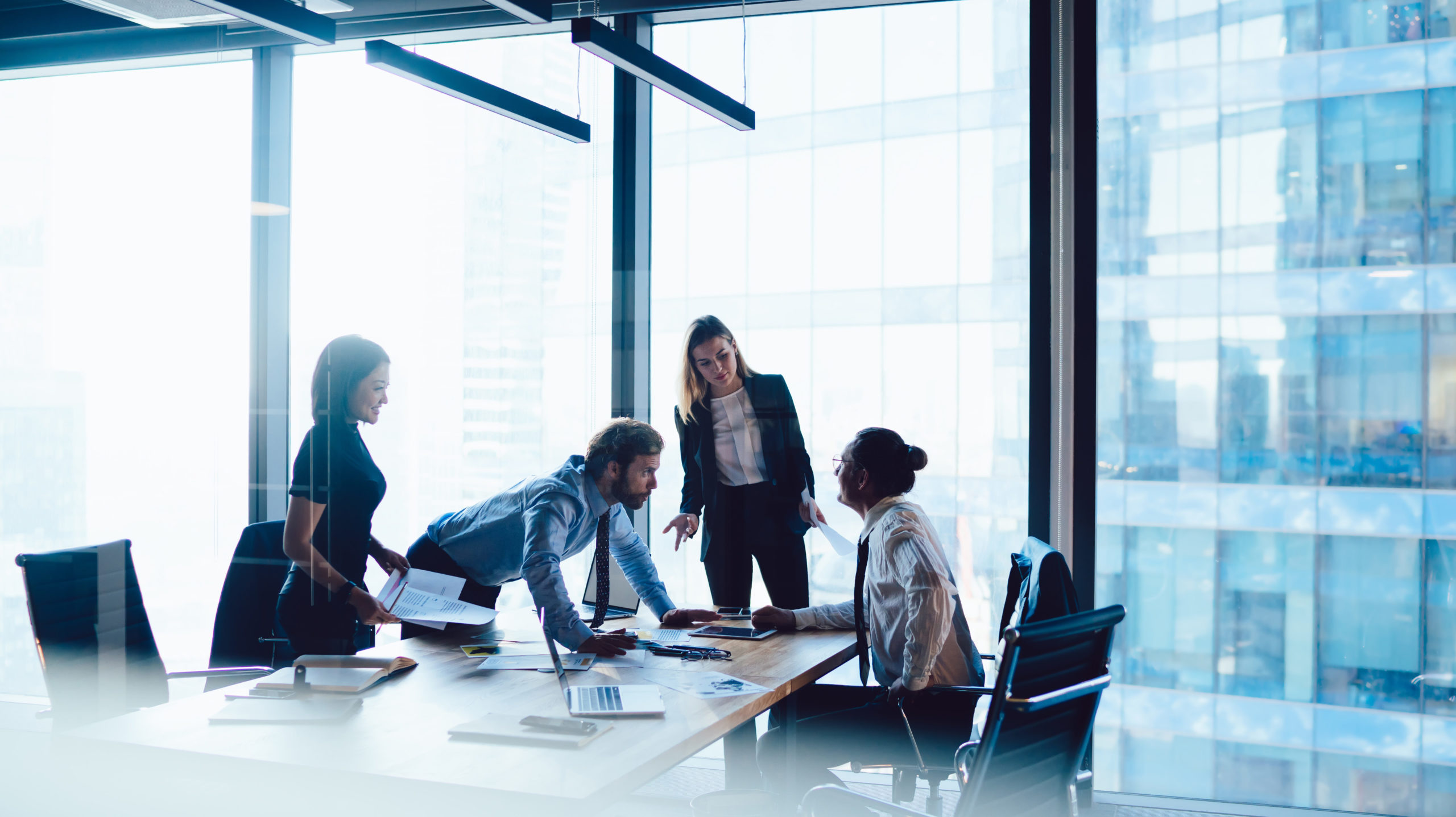 Crew of intelligent male and female having meeting table for dis