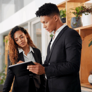 hotel staff looking at a handbook