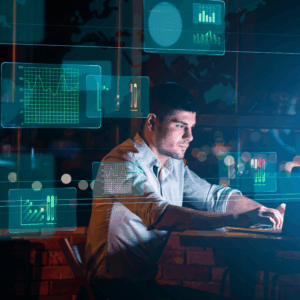 Collage With Businessman Working In Office And Digital Interface With Business Graphs