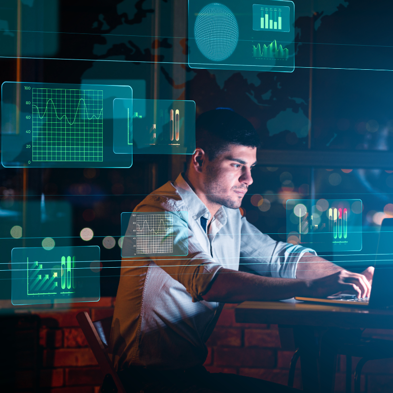 Collage With Businessman Working In Office And Digital Interface With Business Graphs