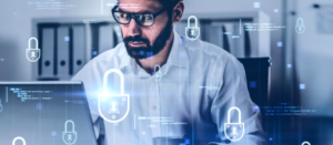 cyber professional looking at computer