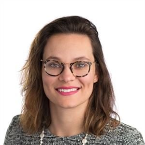 Professional woman smiling in a headshot