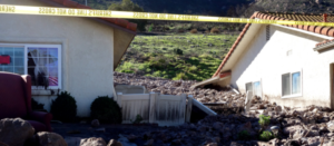 Mudslides destroys house and homes with rocks and debris in suburban area of California
