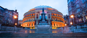 UK Theater on a rainy evening with outdoor lighting surrounding the area of the building.