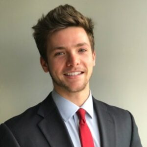 Adam Yungmeyer a business man smiling in a headshot.