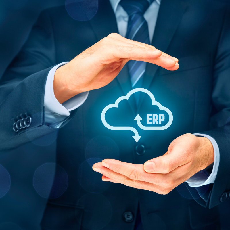 ERP bold lettering inside a digital cloud that is being held by a business man.