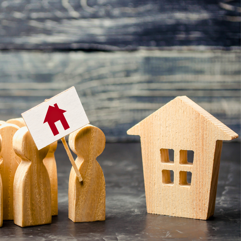 Graphic of wooden individuals and a depiction of an affordable wooden house.