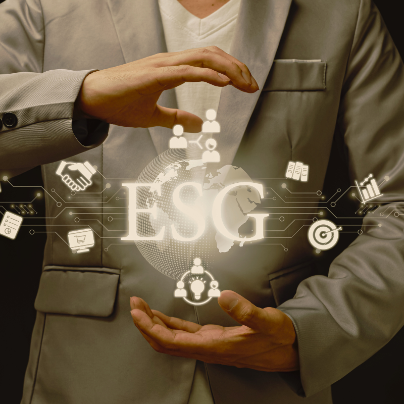 A business man holding a virtual depiction of ESG
