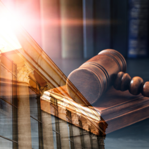 Double exposure of wooden gavel and court building,