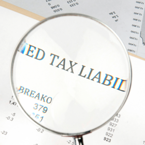 Magnifying glass showing the words tax liability
