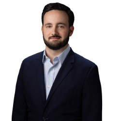 Profile headshot of Bryan DiMonte in a black suit coat.