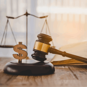 Judge hammer with the dollar placed - concept of IRS audit judgment and justice on business deduction tax.