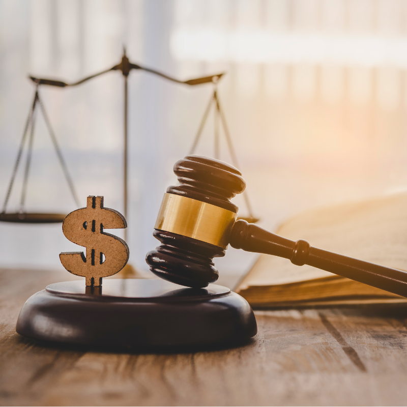 Judge hammer with the dollar placed - concept of IRS audit judgment and justice on business deduction tax.
