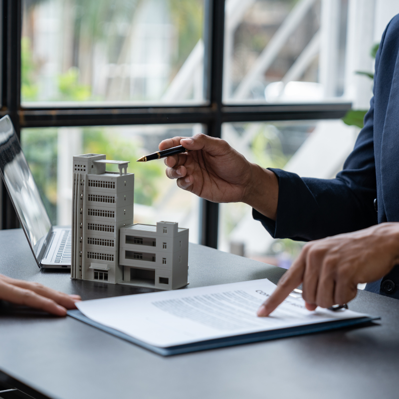 An insurance agent explains the details of the condo purchase contract to calculate the financial Condo Development Taxes