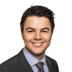 Profile headshot of Jeffrey Lea in a gray suit coat.