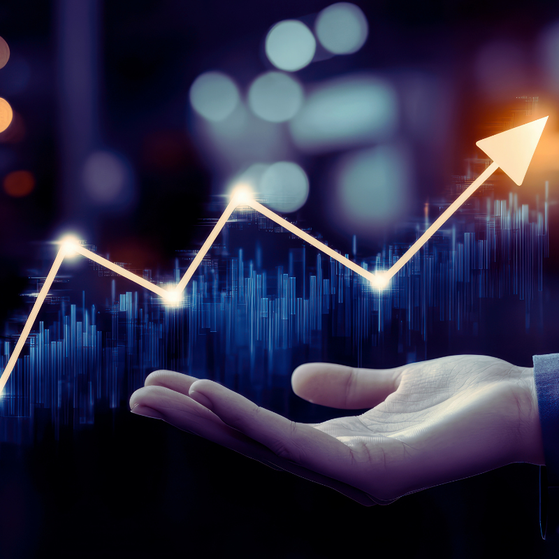 A hand analyzing growth trends in a graph scale within a company's financial profile and industry.