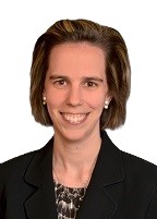 Profile headshot of Susan McGuire in a black suit coat.