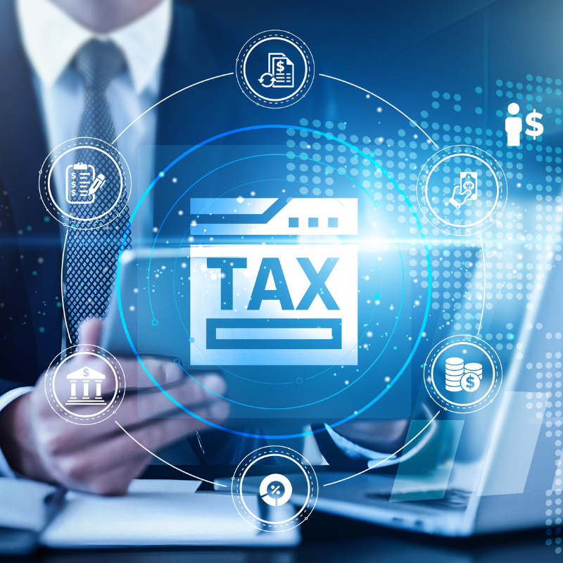 tax professional using a tablet with a digital interface overlay showing tax calculations, financial data, technology graphs on deductions, exemptions, filings, regulations, compliance, projections.