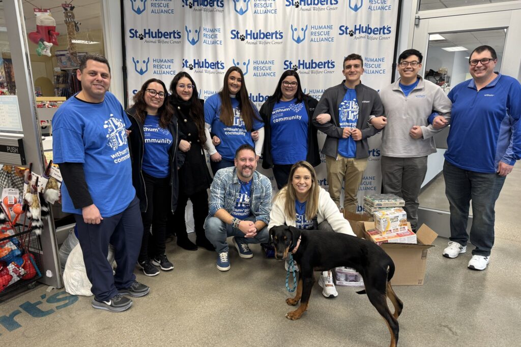 Withum team member smiling while volunteering