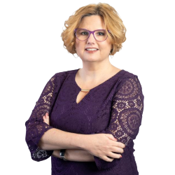 Profile headshot of Christine Flaker in a purple top.