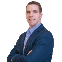Profile headshot of Ian Taylor in a blue suit coat.