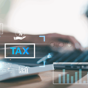 A person types on a laptop with digital tax-related graphics and icons overlaying the image, including the word "TAX" and financial symbols.