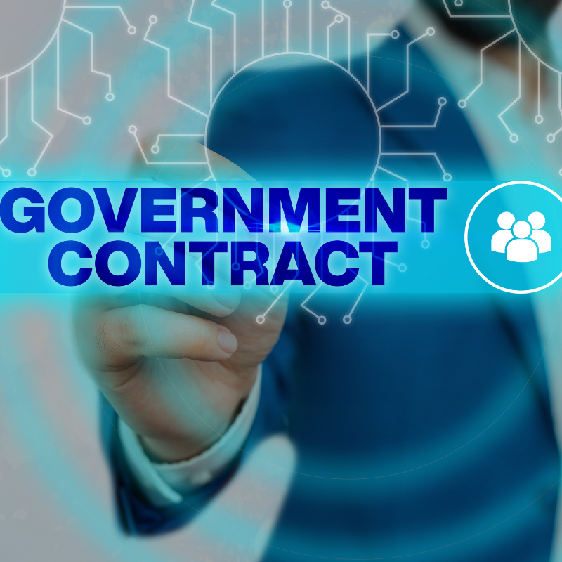 Big blue text highlighting the term Government Contract. Conceptual photo to depict DCAA Audits.