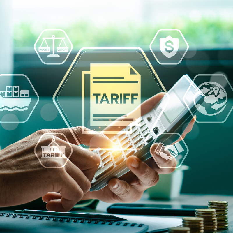 Businessman Using Calculator to determine Global Import Export tariff refund.