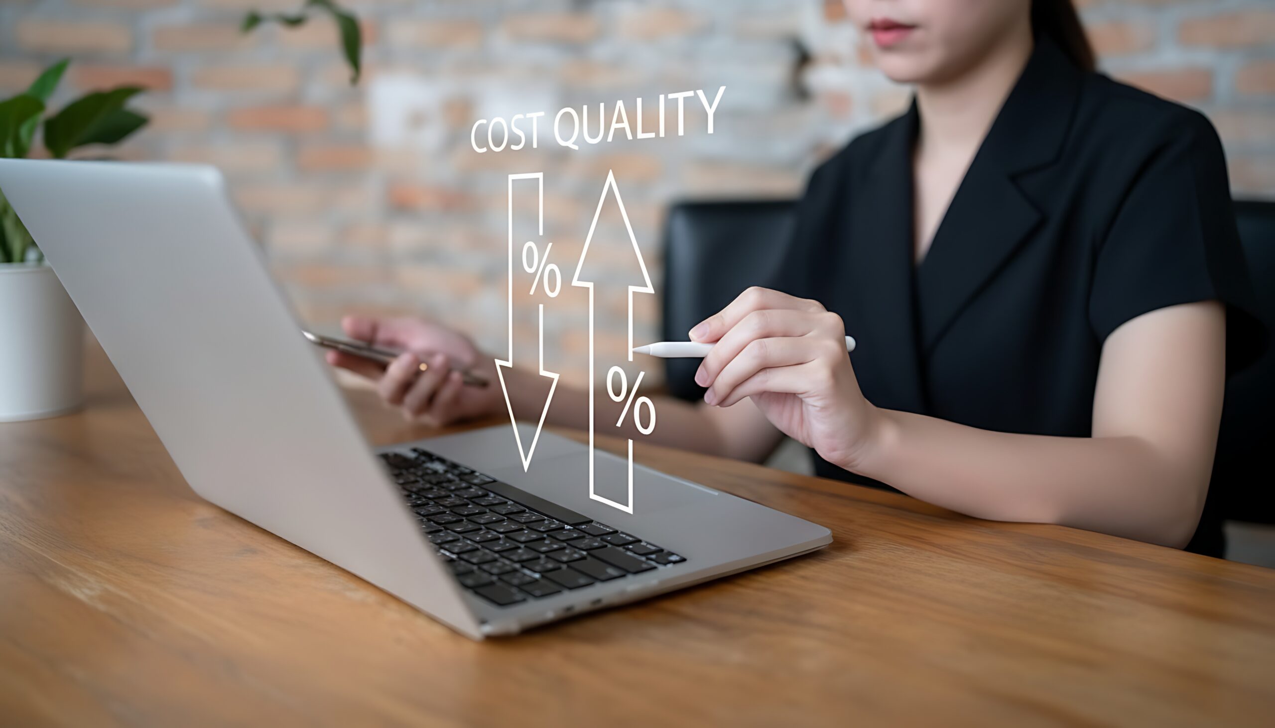 Businesswoman using laptop with digital overlay for cost and quality analysis