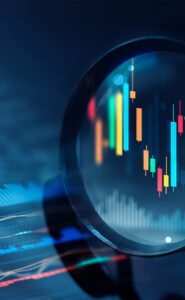 Magnifying glass focusing on financial charts and valuation data.
