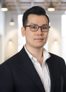 New Partner Brian Koon in Black blazer and White shirt.