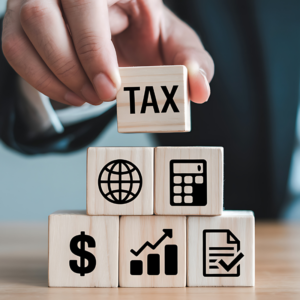 Tax Planning Concept: Businessman Arranging Wooden Blocks with Financial Icons and TAX Text Representing Corporate Finance and Growth Strategy