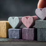 Hearts on various sized blocks representing steps or processes in nonprofits