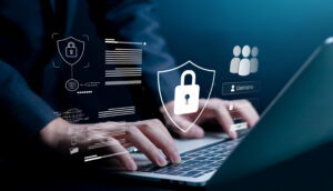 Business professional typing on laptop with cybersecurity lock icons and login interface. Concept of data protection, online privacy, secure access, password authentication and network security.