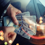 City and hands of a man with handcuffs on a background of us dollars. Fraud, cyber crime concept.