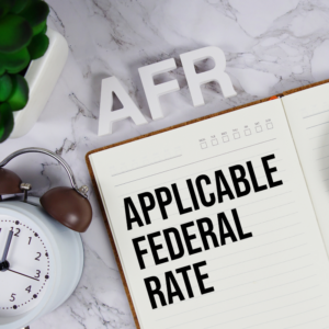 AFR - Applicable Federal Rate acronym on notepad, Business concept background